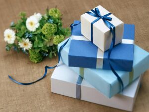 Image of blue gift boxes stacked on top of one another